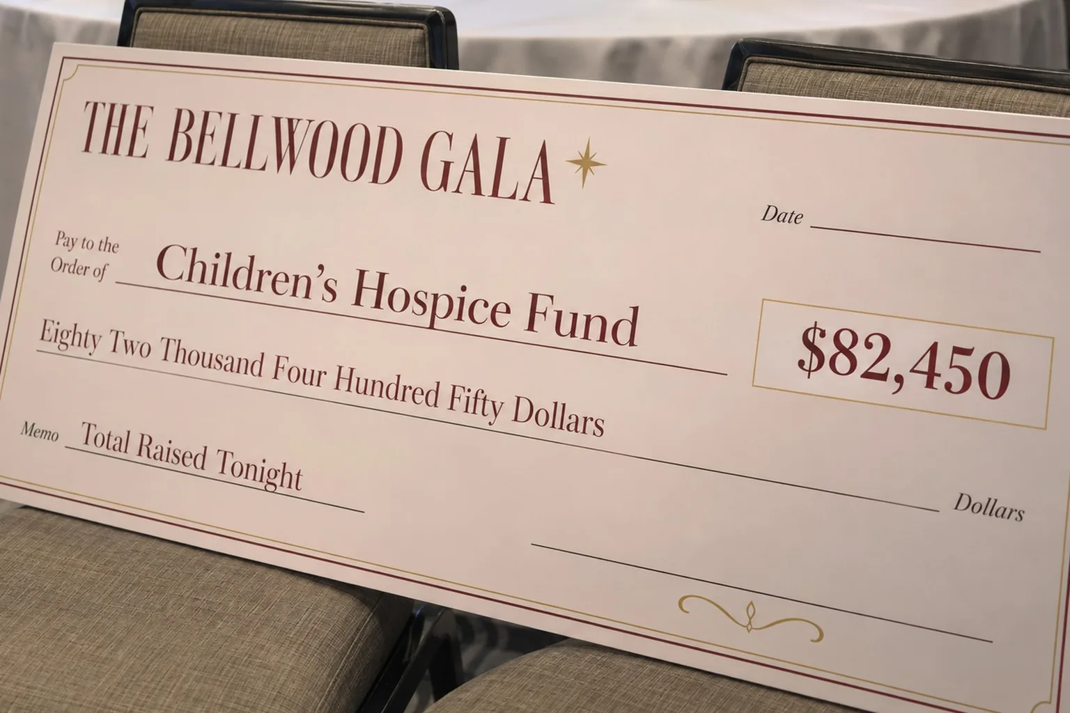 Custom giant fundraising check showing a gala total raised